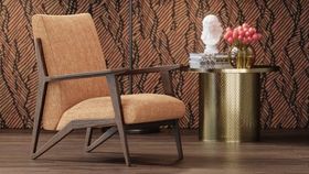 Luxurious 3D rendered scene featuring mid-century modern armchair in terracotta fabric, dark wood frame, brass side table with decorative accessories against patterned wallpaper